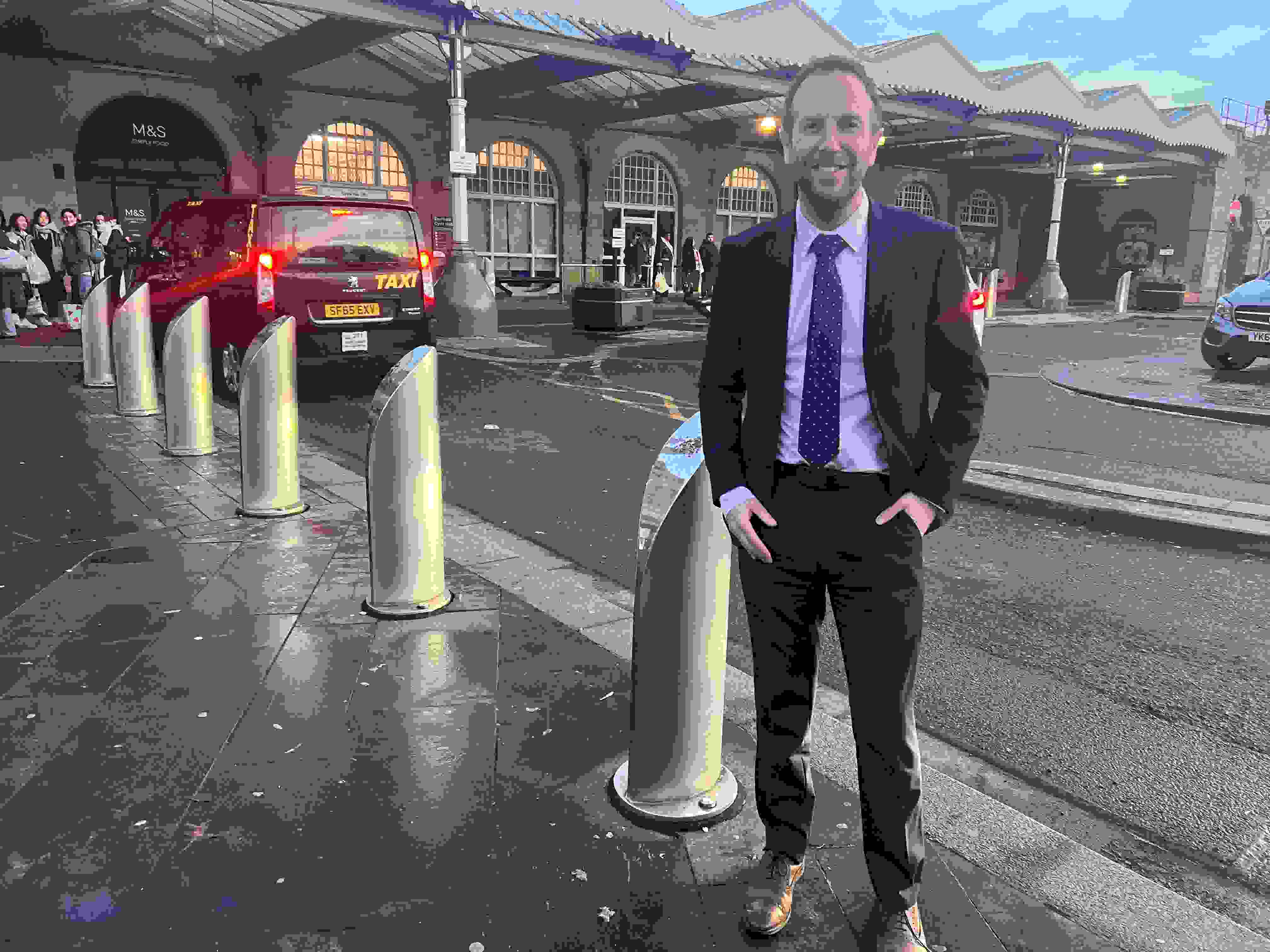 Cllr Miskell stands at Sheffield Station