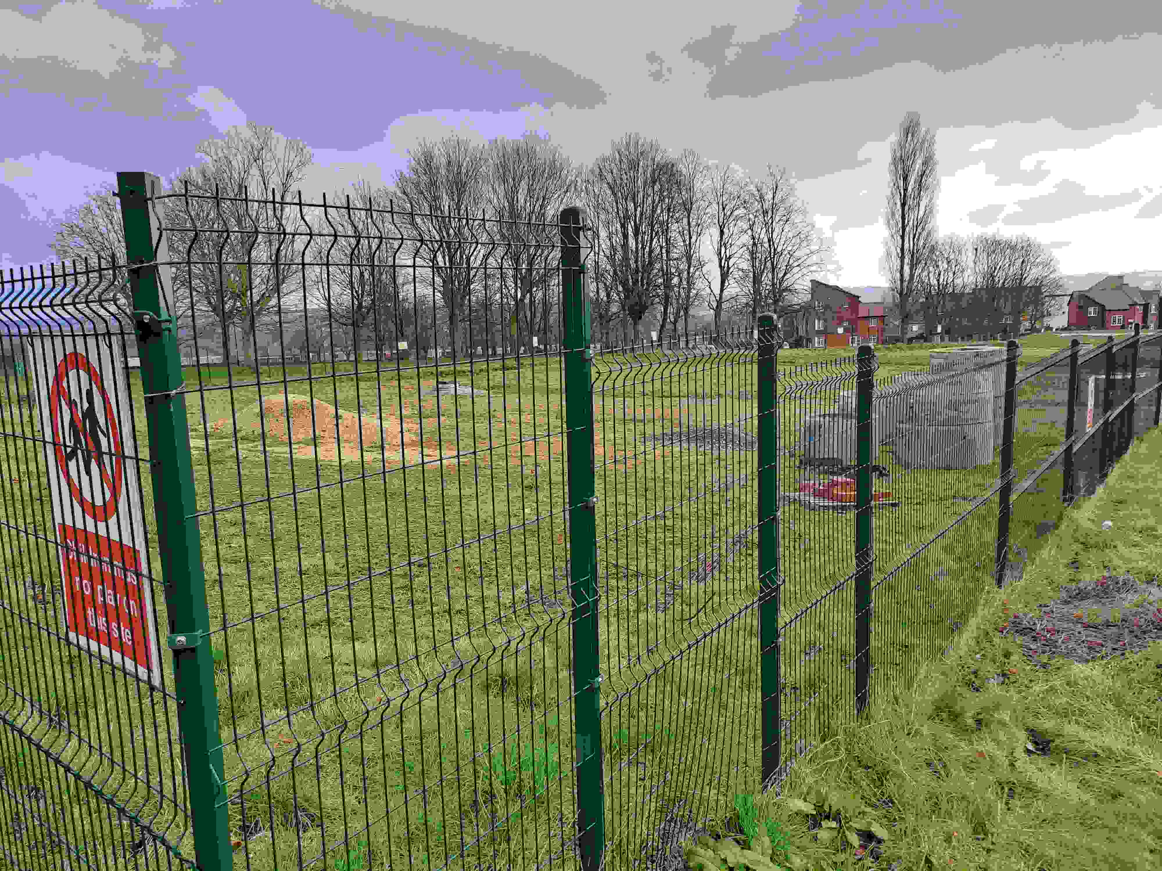 The second development site for council homes in Newstead, Sheffield, is surrounded by a green fence