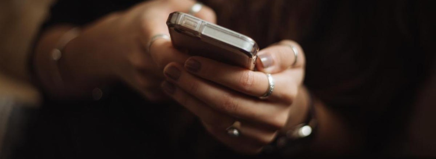 Hands holding a mobile phone