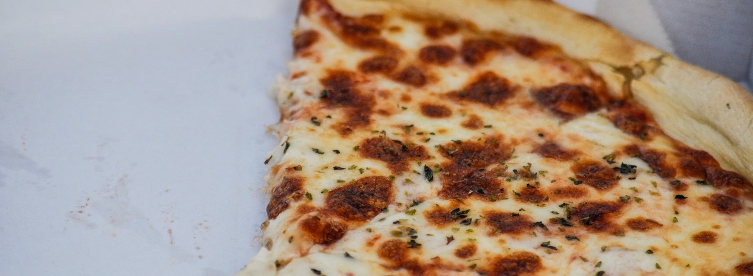 Slices of pizza in a takeaway box