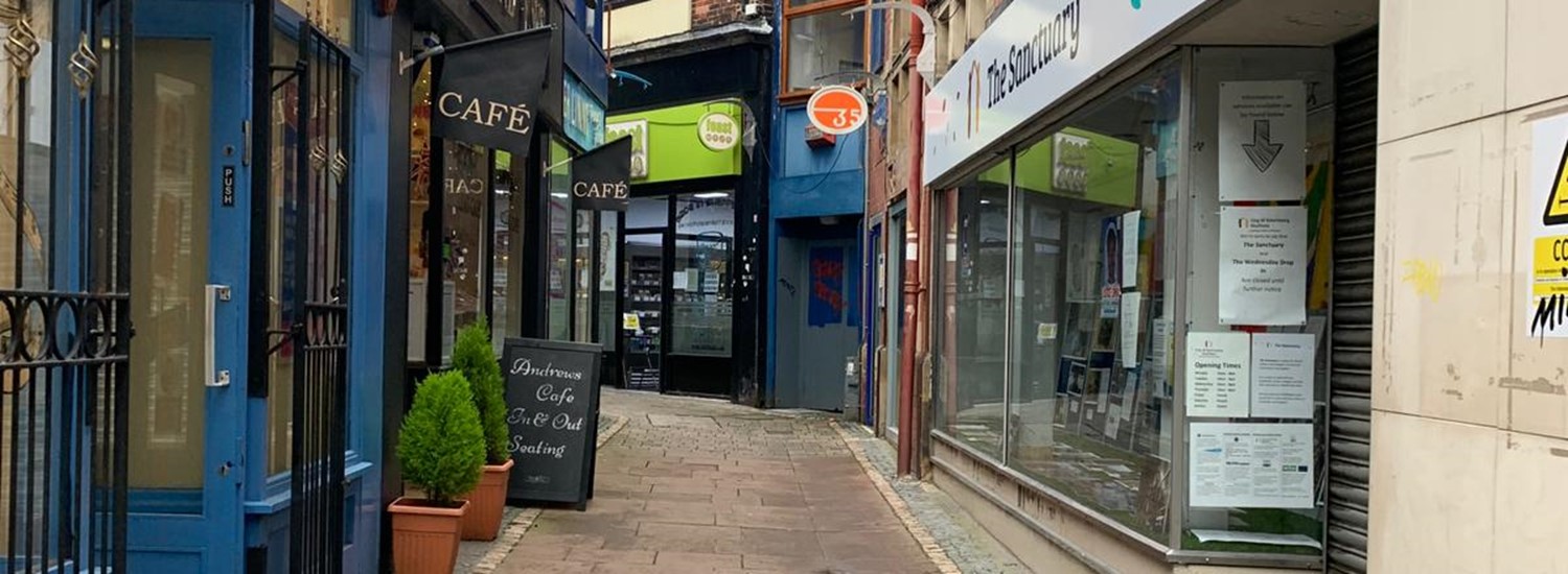 alley way lined with shops