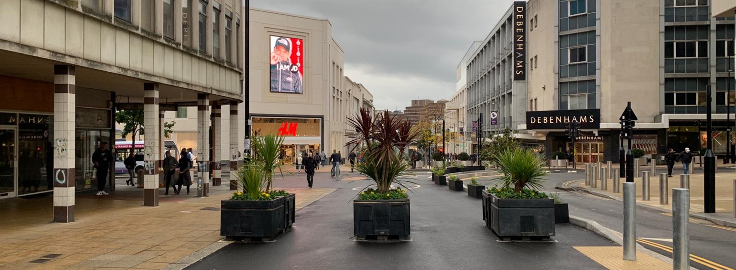 Shop lined Pinstone Street in Sheffield City Centre