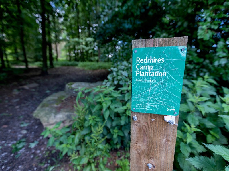 Sign for Redmires Plantation on the edge of the forest