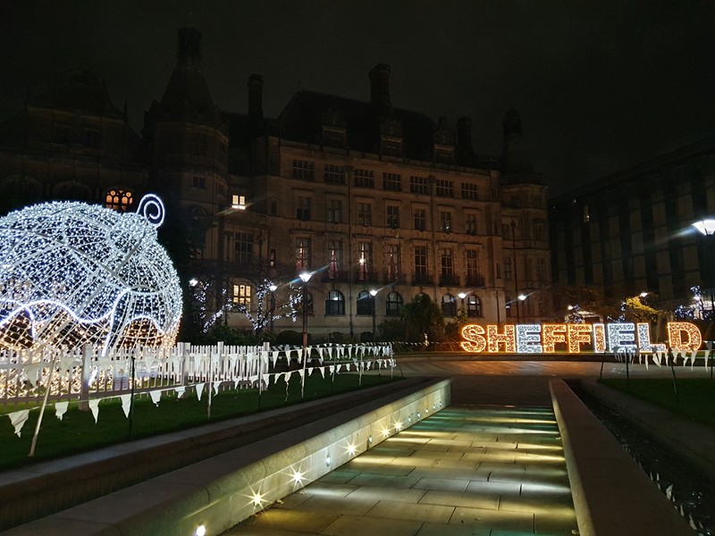 Large Christmas bauble lit up in Sheffield Peace Gardens