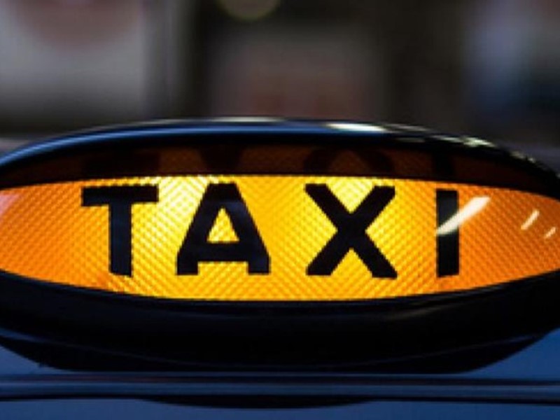 Taxi sign lit up 