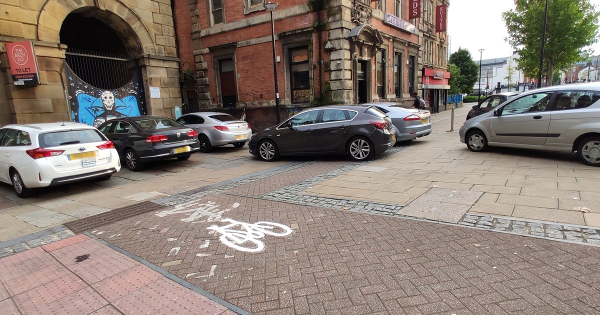 Cars parked on pavement 