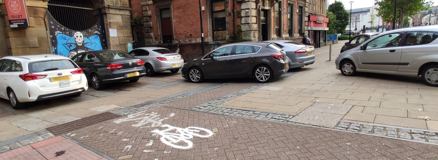 Cars parked on pavement