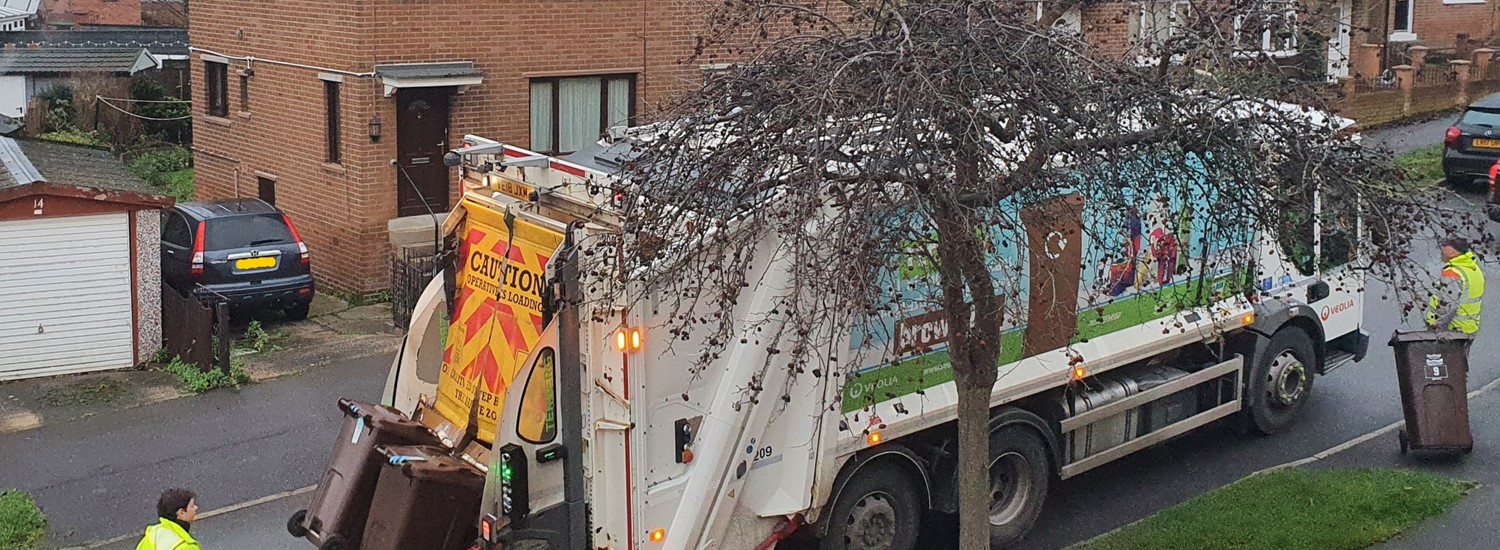 bins being emptied in to bin lorry