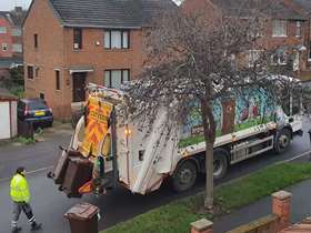 Bins being emptied in to a bin lorry