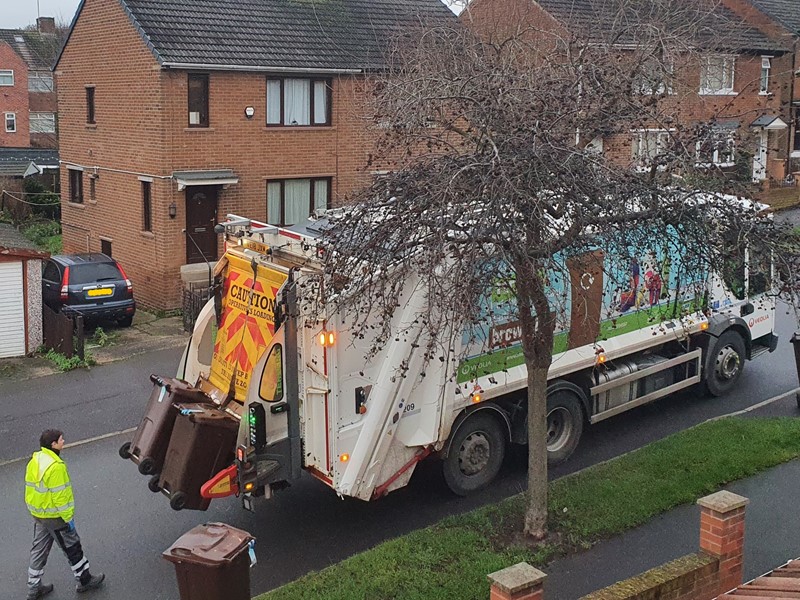 Bin wagon collecting wheelie bin