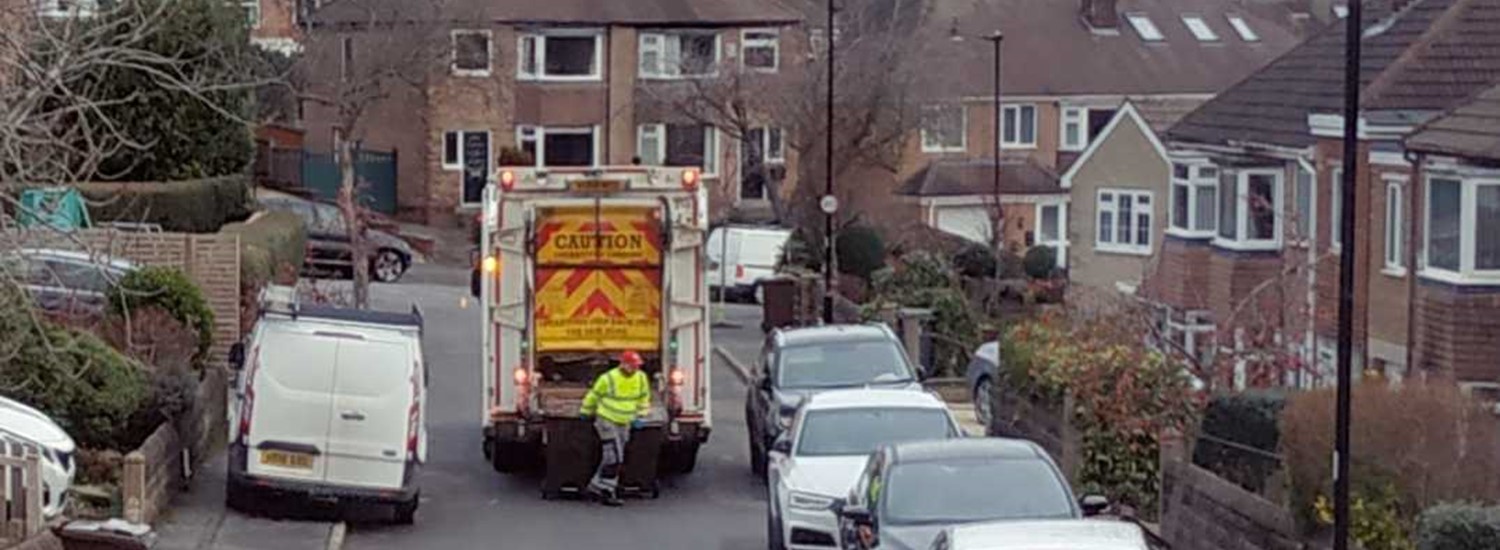 Black bins out for collection on a street in Sheffield