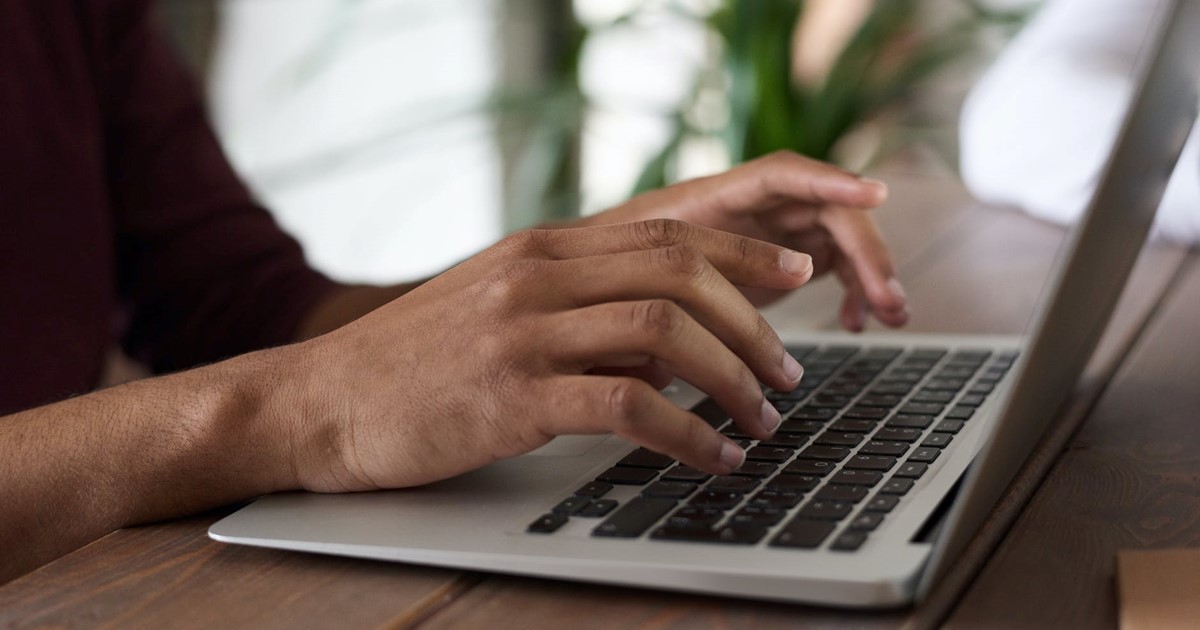 Person typing on laptop 