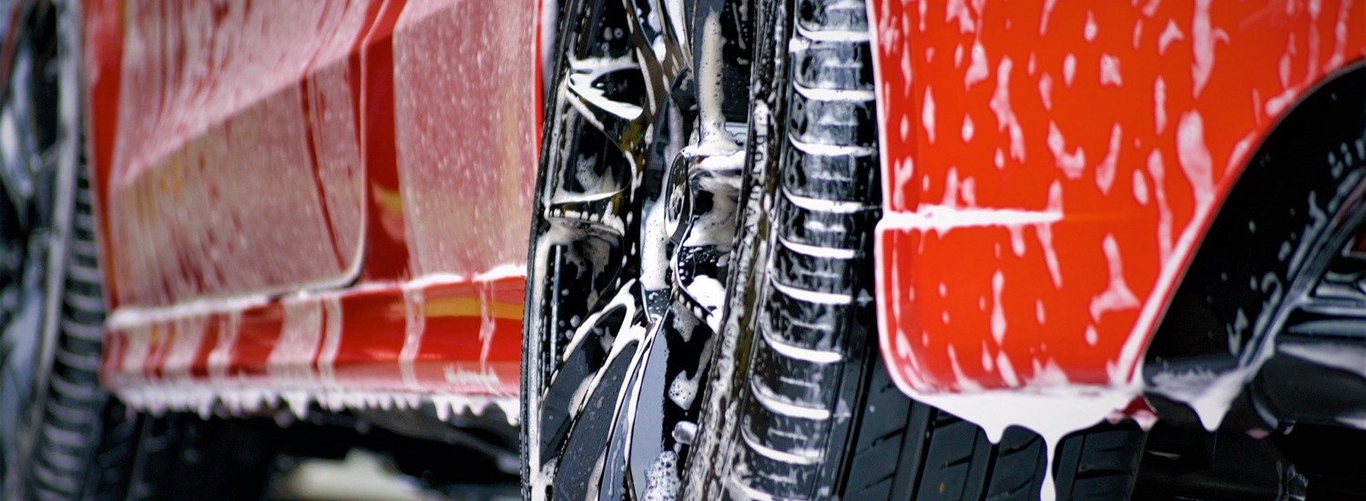 Red car with soap residue on it