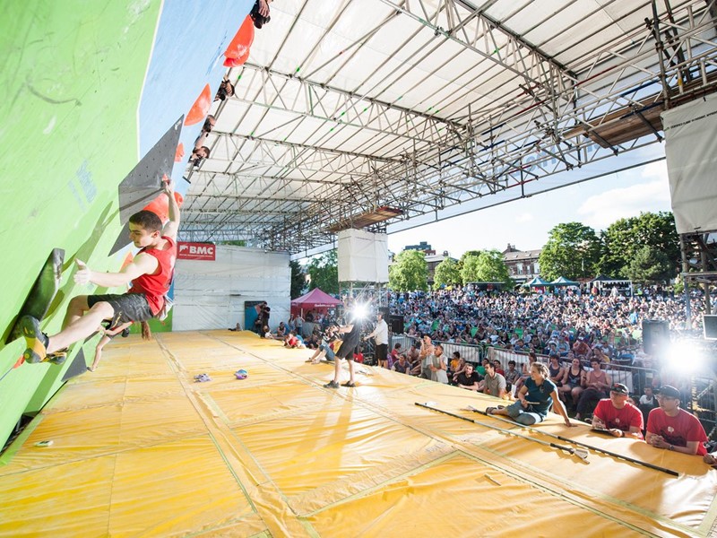 Competitor climbing on a bouldering wall