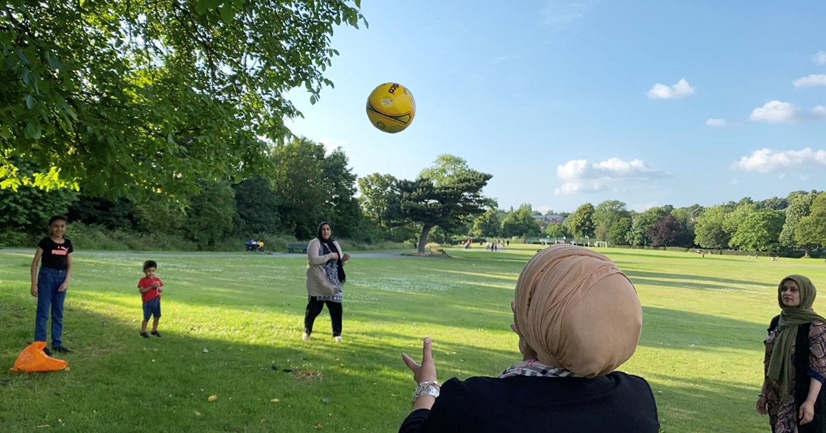 Group of women and children playing ball games in Firth Park