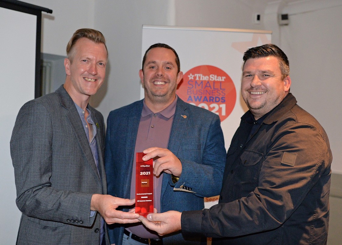 Cllr Paul Turpin, Executive Member for Inclusive Economy, Jobs and Skills, presents the Environmental Impact award to All Seasons Interiors, Richard Moule and Kevin Oldfield