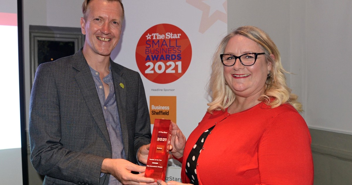Councillor Paul Turpin, Executive Member for Inclusive Economy, Jobs and Skills, presents the Retailer of the Year award to Miss Samantha's Vintage owner Sam Parsonage