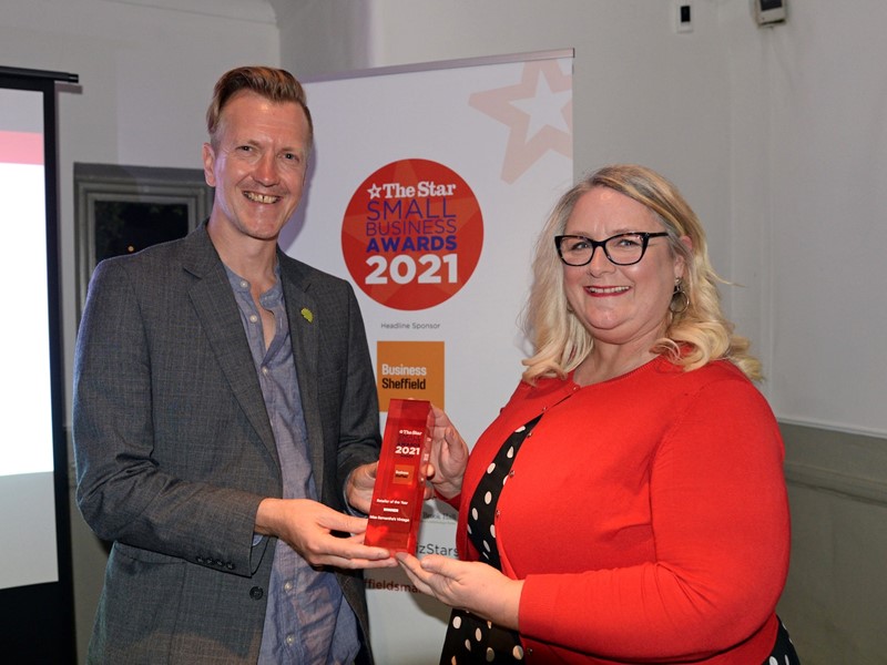 Councillor Paul Turpin, Executive Member for Inclusive Economy, Jobs and Skills, presents the Retailer of the Year award to Miss Samantha's Vintage owner Sam Parsonage