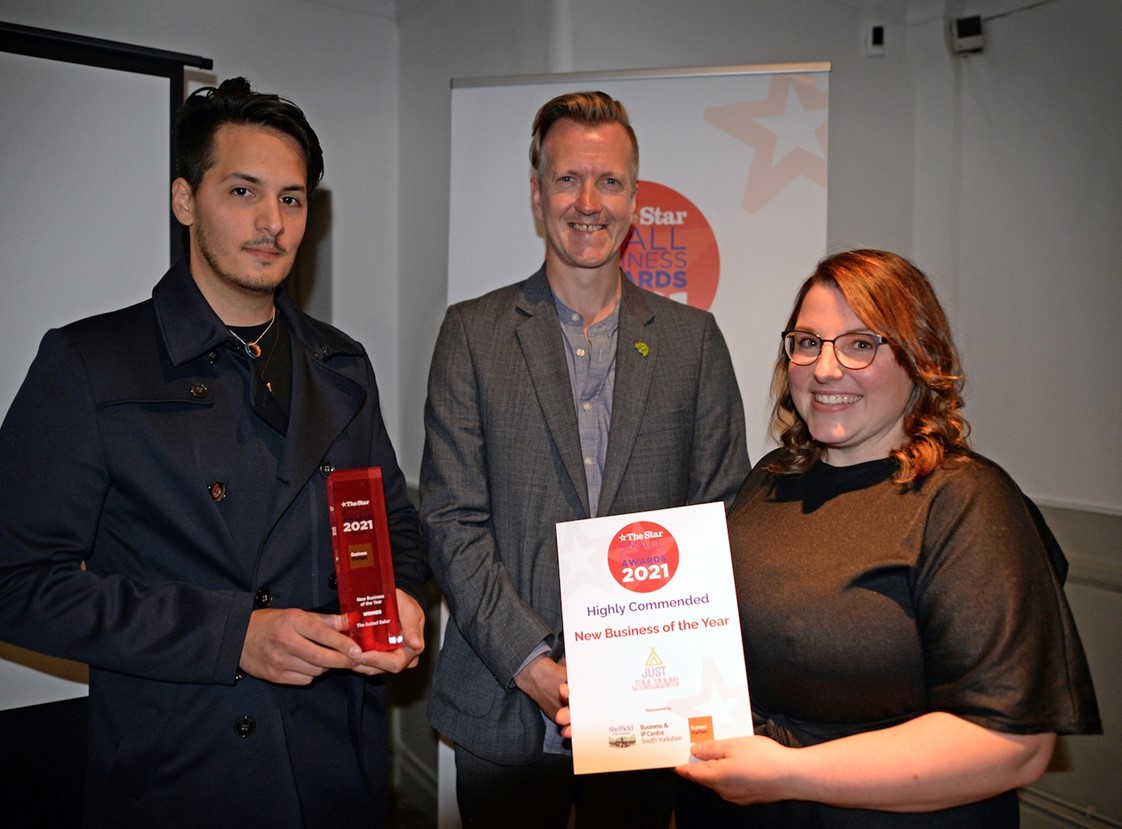 Councillor Paul Turpin, Executive Member for Inclusive Economy, Jobs and Skills, presents the New Business of the Year award to The Suited Baker Ermes Giummarresi and finalist Just JimJams Sarah McKeown, who were Highly Commended.