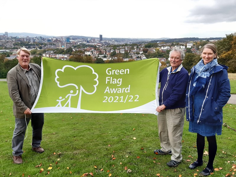 People holding green flag in Meersbrook Park