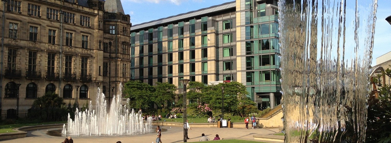 Town hall with the fountains on view, a sunny day with clouds