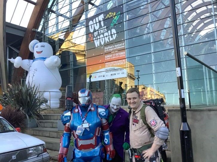 Out of This World visitors, including Captain America, The Joker and a Ghostbuster, pose in costumes for the event