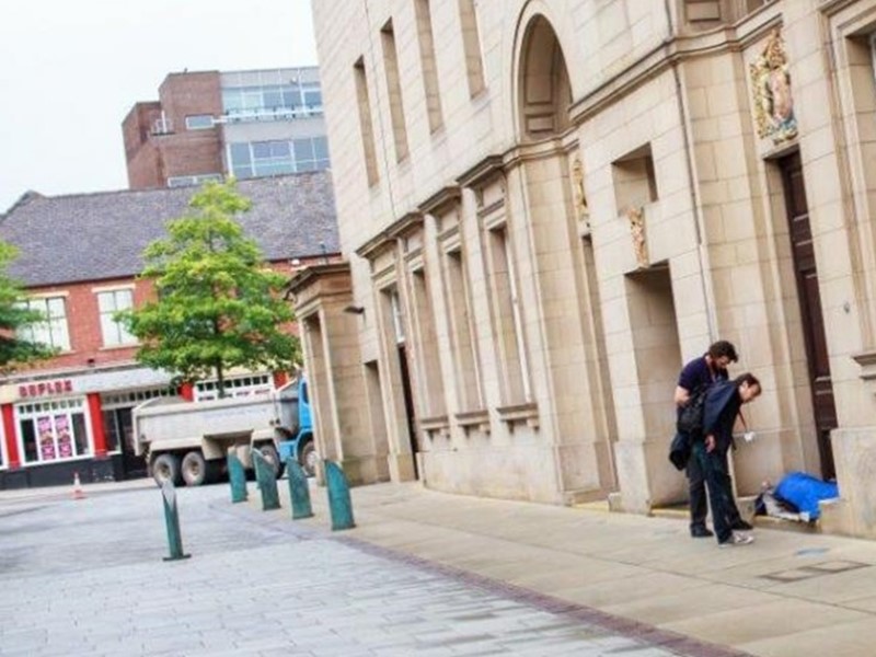 City Hall with two outreach workers talking with a person sleeping rough