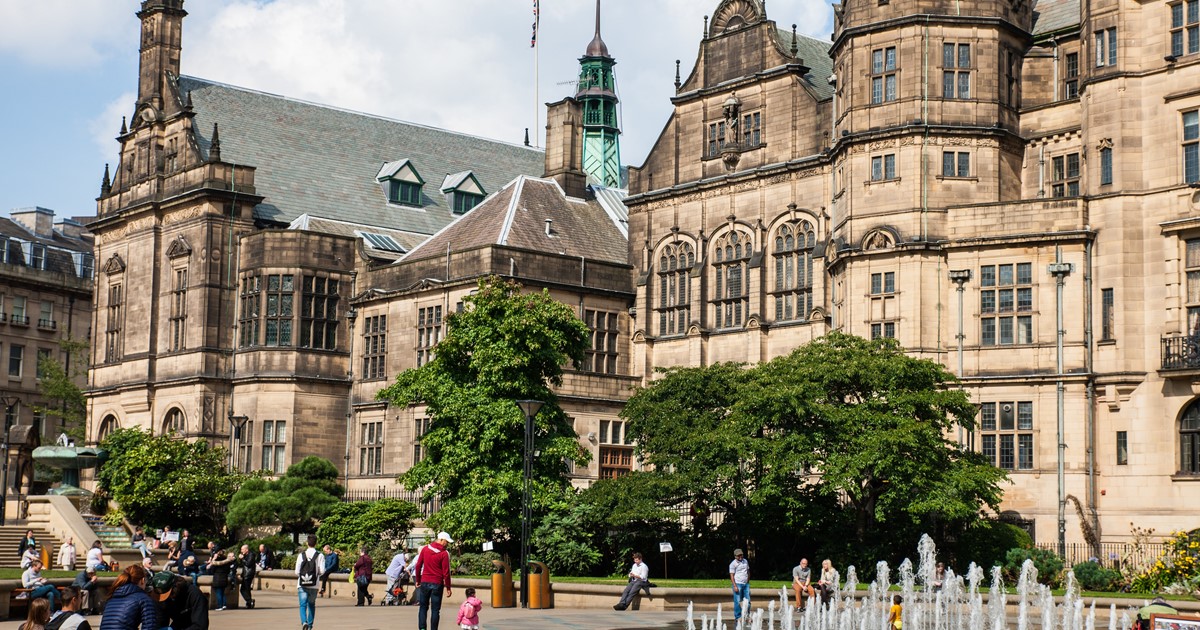 Town Hall and Peace Gardens, fountain on, people walking through the gardens