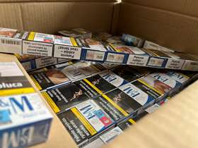 A box full of packets of cigarettes seized during a raid in Sheffield