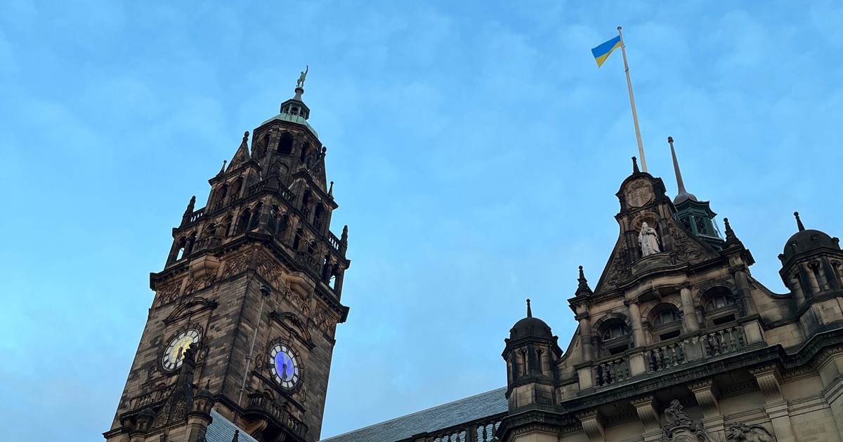 Town Hall with blue sky and Ukraine flag at full mast