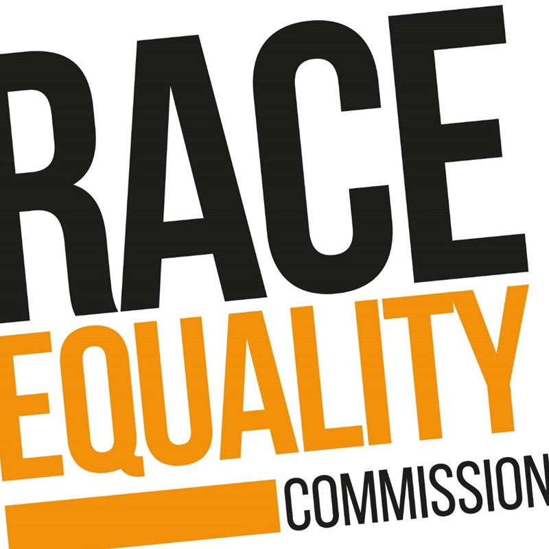 Black and orange writing saying Race Equality Commission