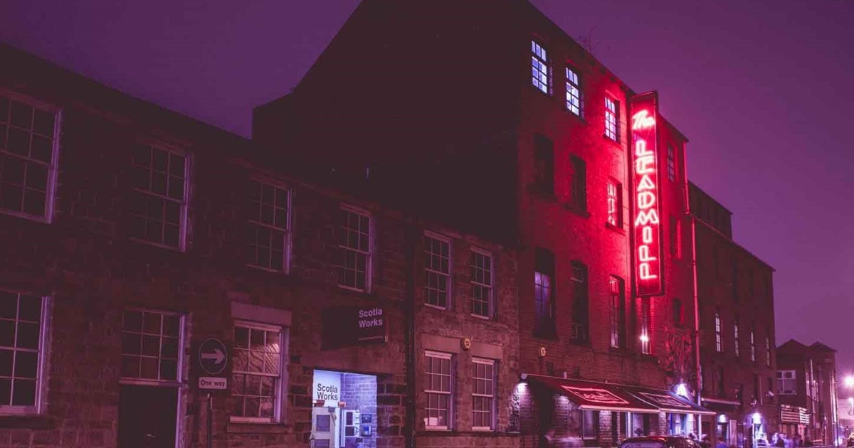 The Leadmill at night with its sign lit up in red 