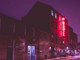 The Leadmill at night with its sign lit up in red