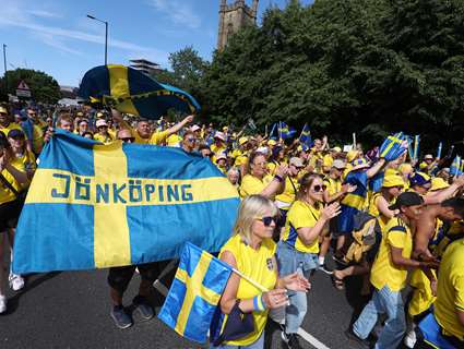 Thousands of fans from Sweden walk through Sheffield with flags and banners dressed in blue and yellow