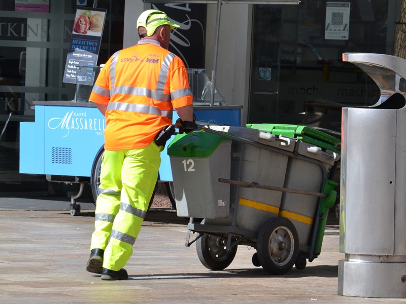 Amey operatives empty a street bin