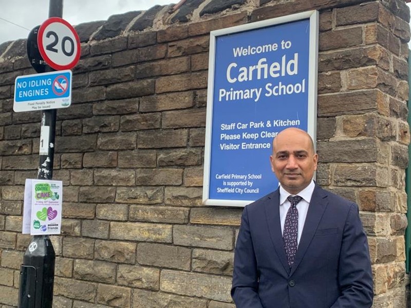 Cllr Mazher Iqbal stands outside Carfield Primary School