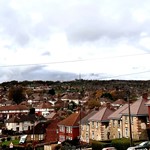 Rows of houses at Southey Green with grey sky looking over the valley 