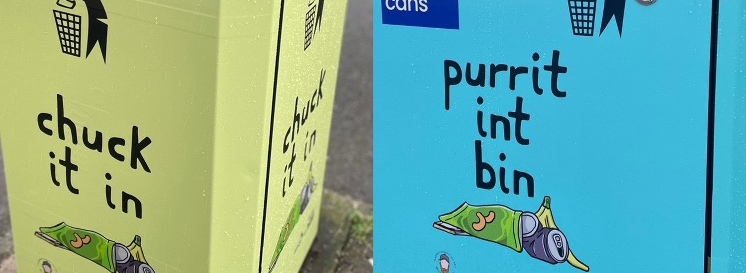 Yellow bin with 'Chuck it in' wording next to blue bin with 'Purrit int bin ' wording