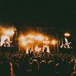Arctic Monkeys road closures Arctic Monkeys live on stage with the crowd infront - photo credit Lewis Evans