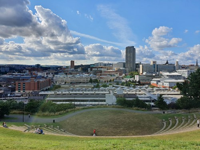 View of Sheffield with Pounds Park in foreground and blue sky with clouds