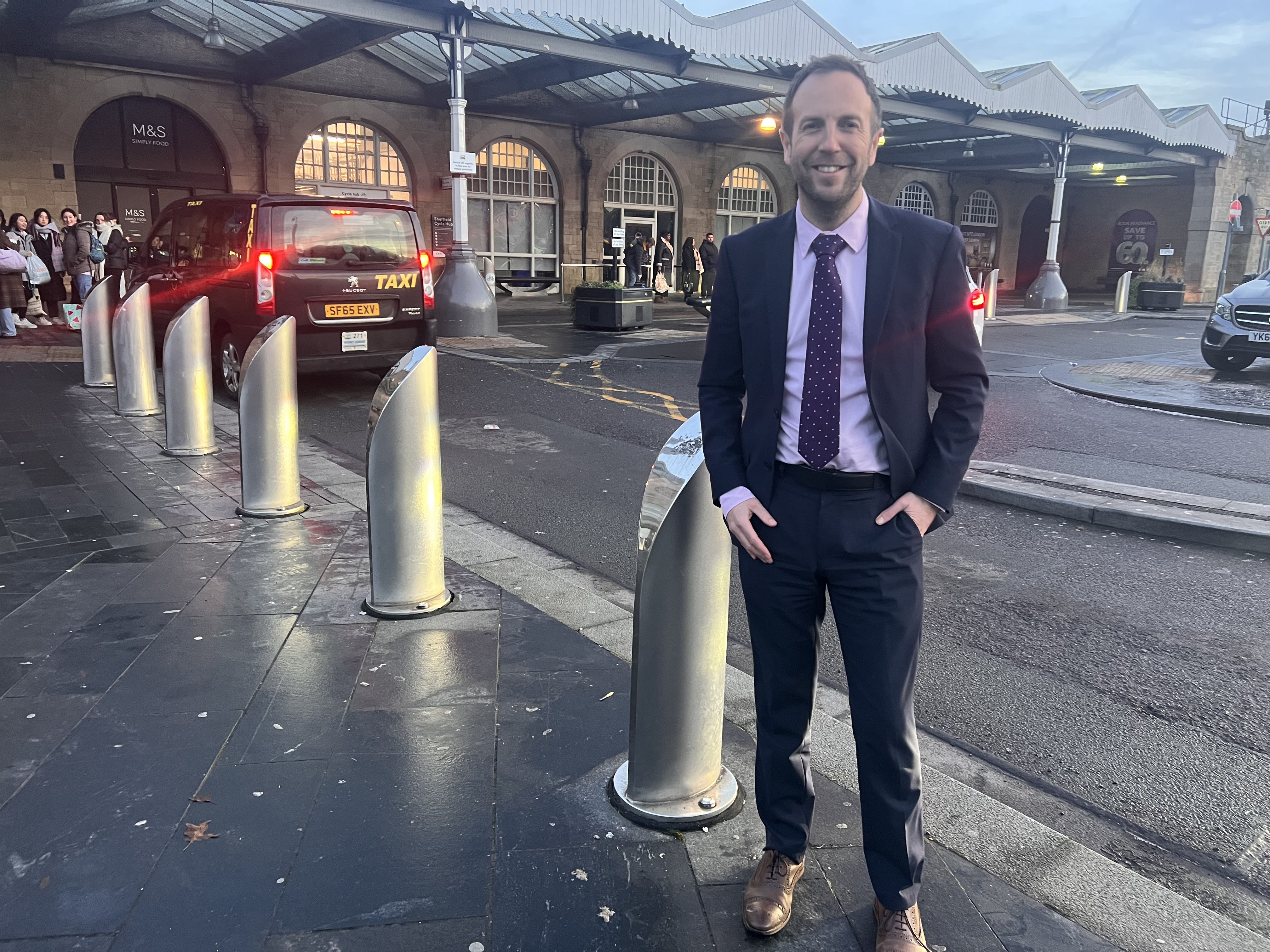 Cllr Miskell stands at Sheffield Station