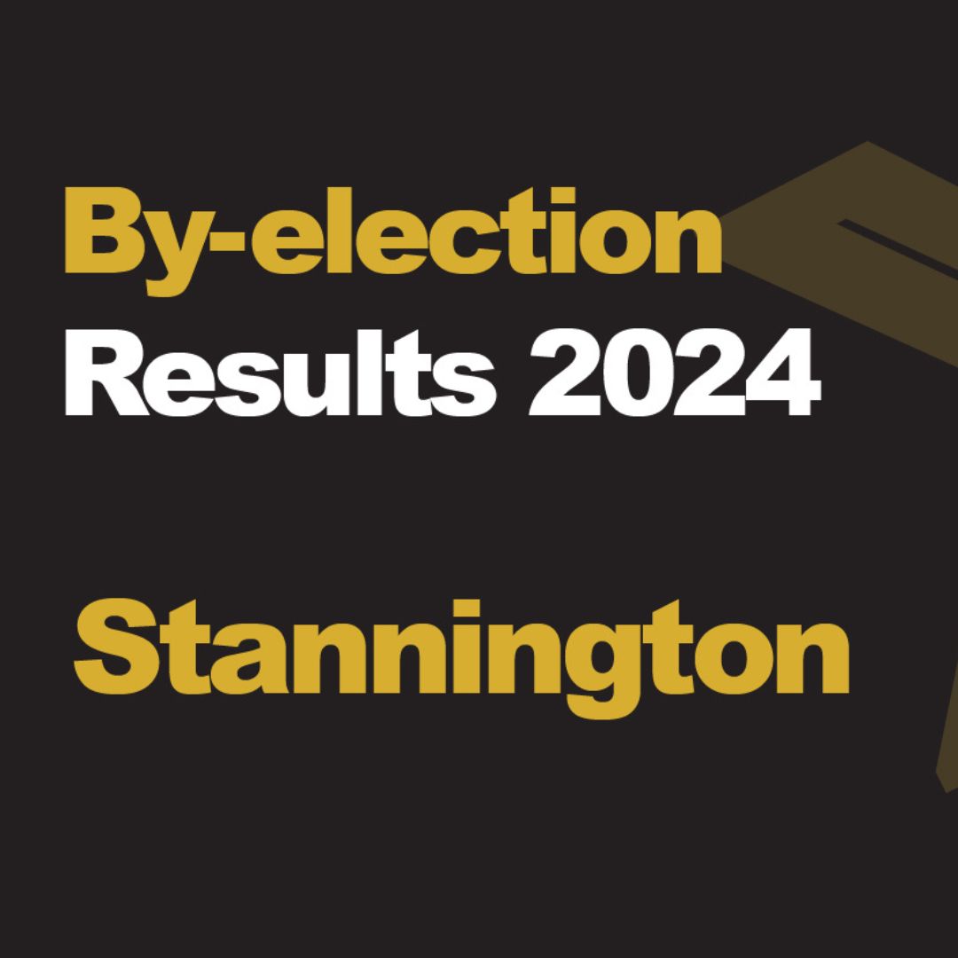 A dark coloured rectangle box with a large orange cross on the right handside, the text reads "Election results 2024 Stannington"