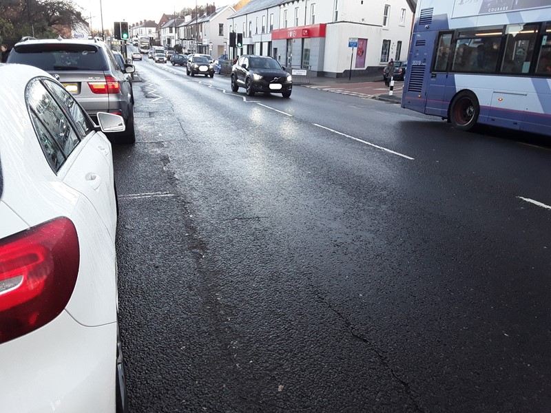 An image showing the road surface of Chesterfield Road and shows cars and buses using the road