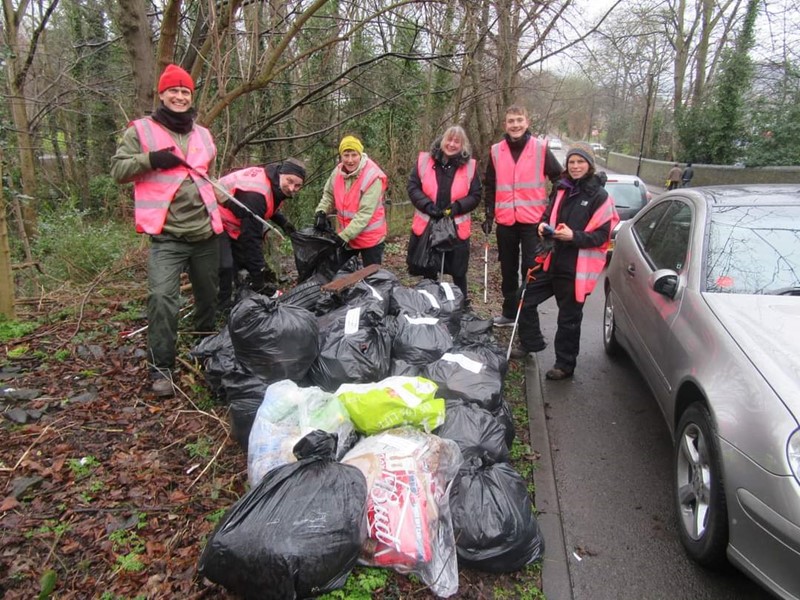 Sheffield Litter Pickers at a previous event on the side of a road pictured with a number of bags of litter 