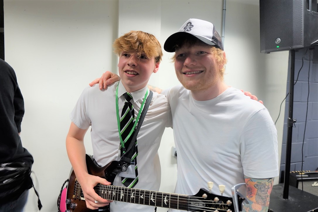 Ed Sheeran with a student.