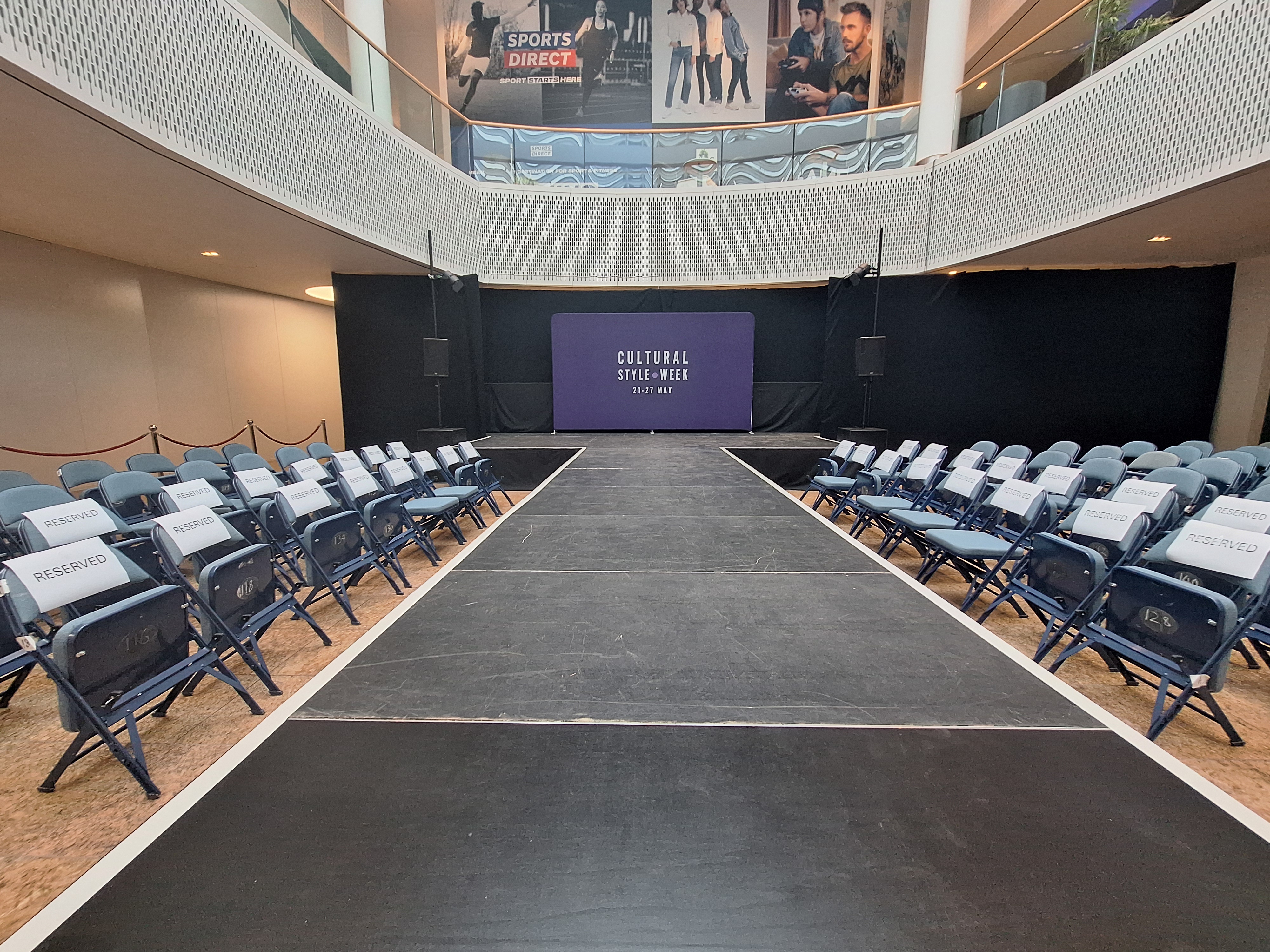 View of the runway with the Cultural Style Week backdrop