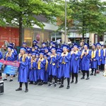 There's still time to join in the Festival of Fun A group of youngsters in university garments and mortarboards stand in line at a Children's University graduation ceremony