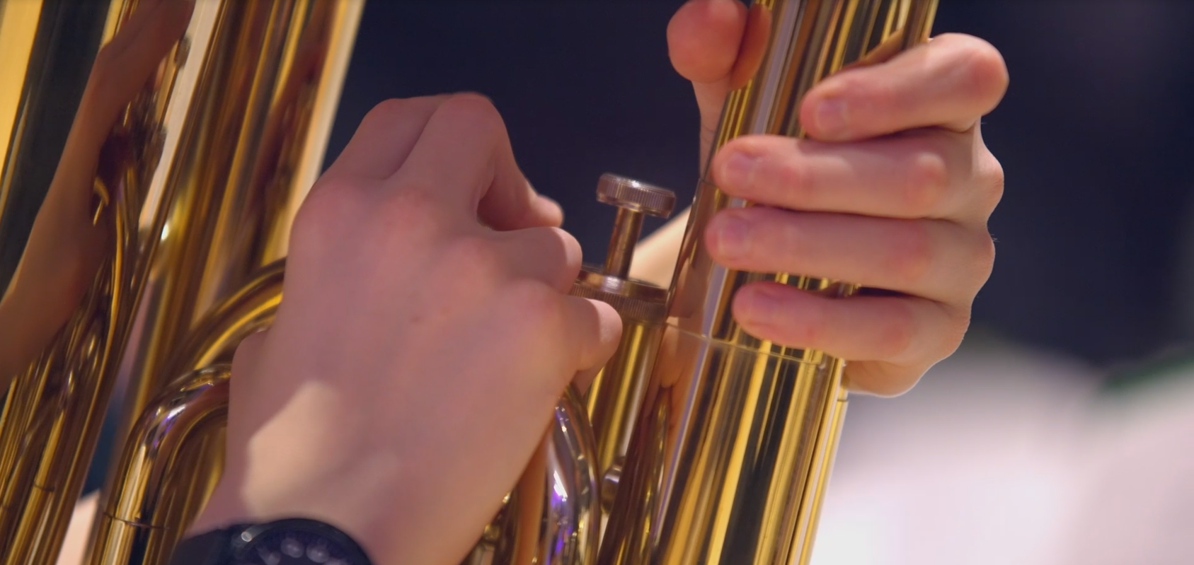 Close up of hands on a trumpet 
