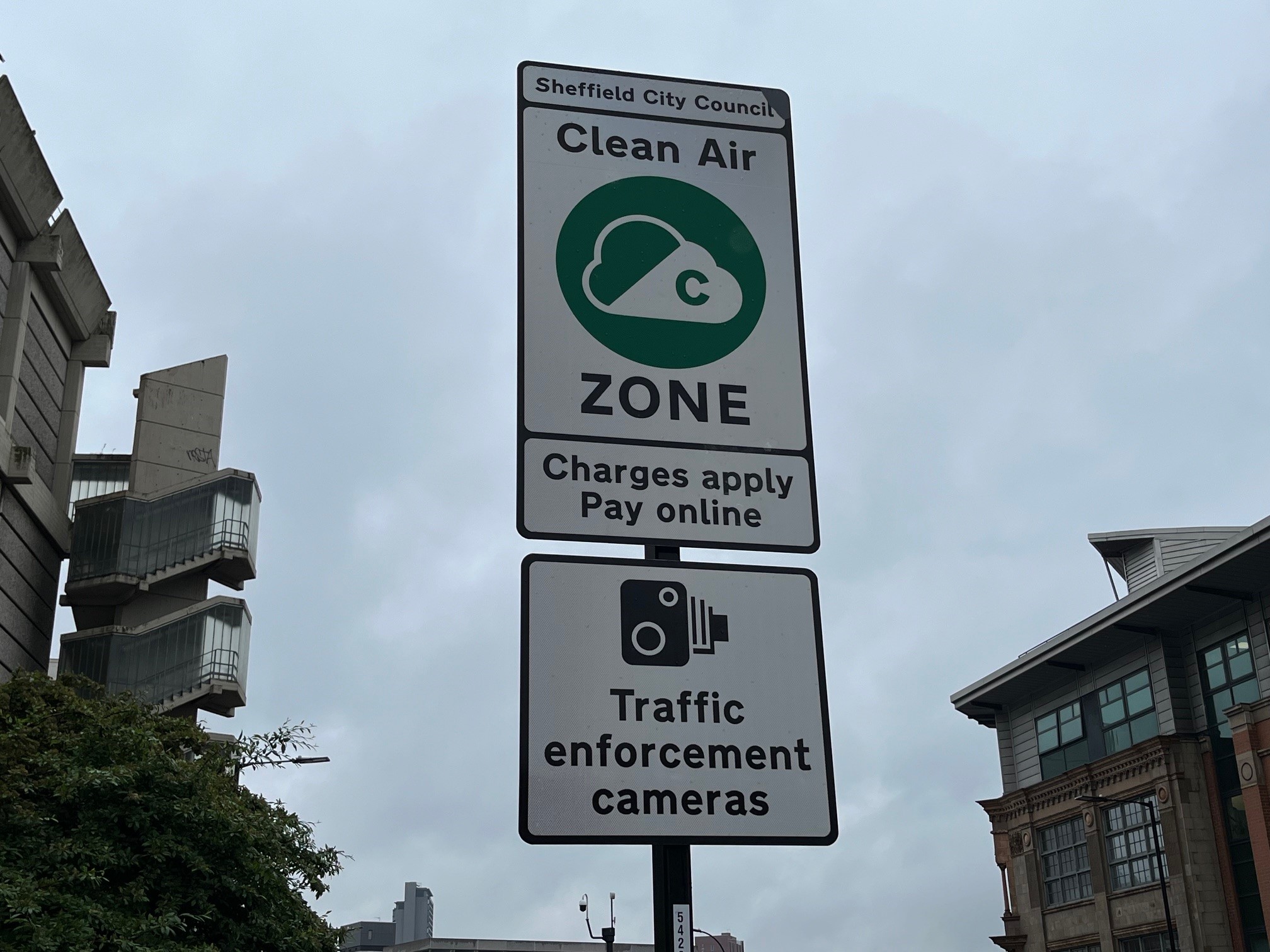 A road sign showing the start of the Clean Air Zone, underneath is another sign with a picture of a camera on it, underneath that are the words Traffic Enforcement Cameras