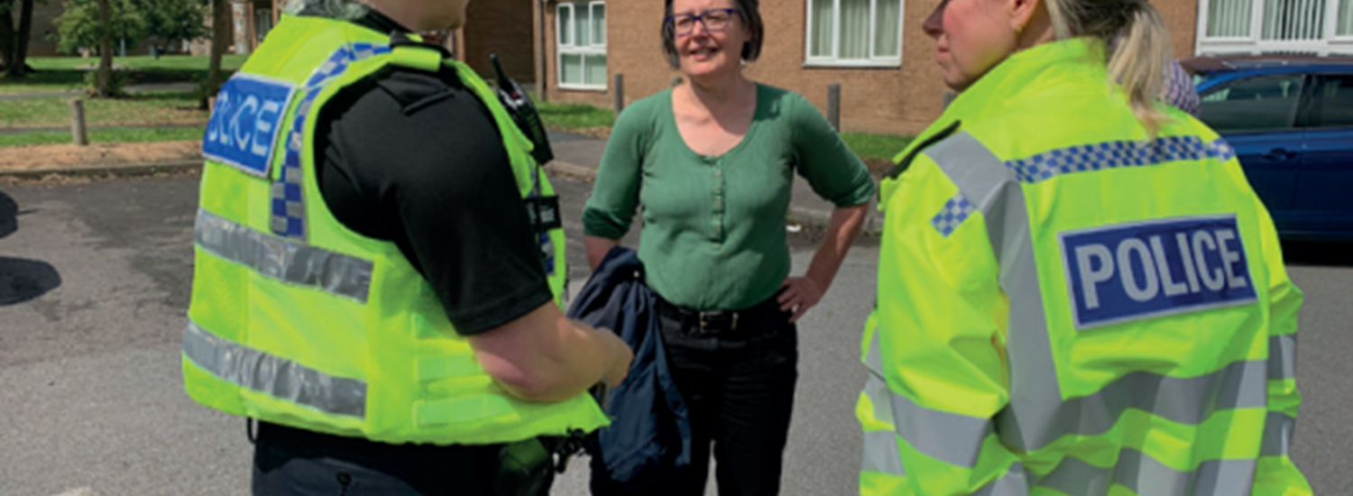 Police speaking to member of the community